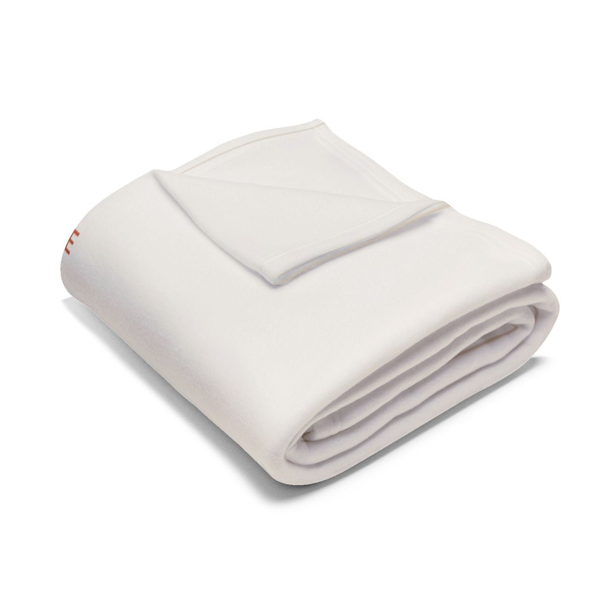 Christmas Eve fleece blanket folded into a bundle, showing the cream fleece and only a sliver of the print at one edge