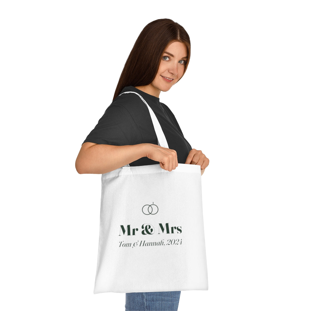 Personalised cotton anniversary tote bag mock-up carried on a woman's shoulder, showing the 'Mr & Mrs' print