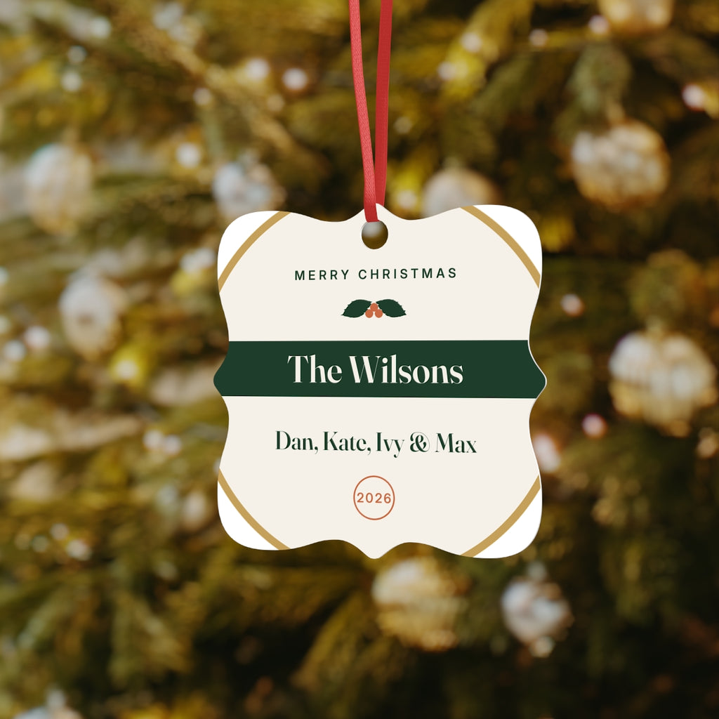 Family aluminium Christmas ornament mock-up on a tree, 'The Wilsons' on a green band above 'Dan, Kate, Ivy & Max'