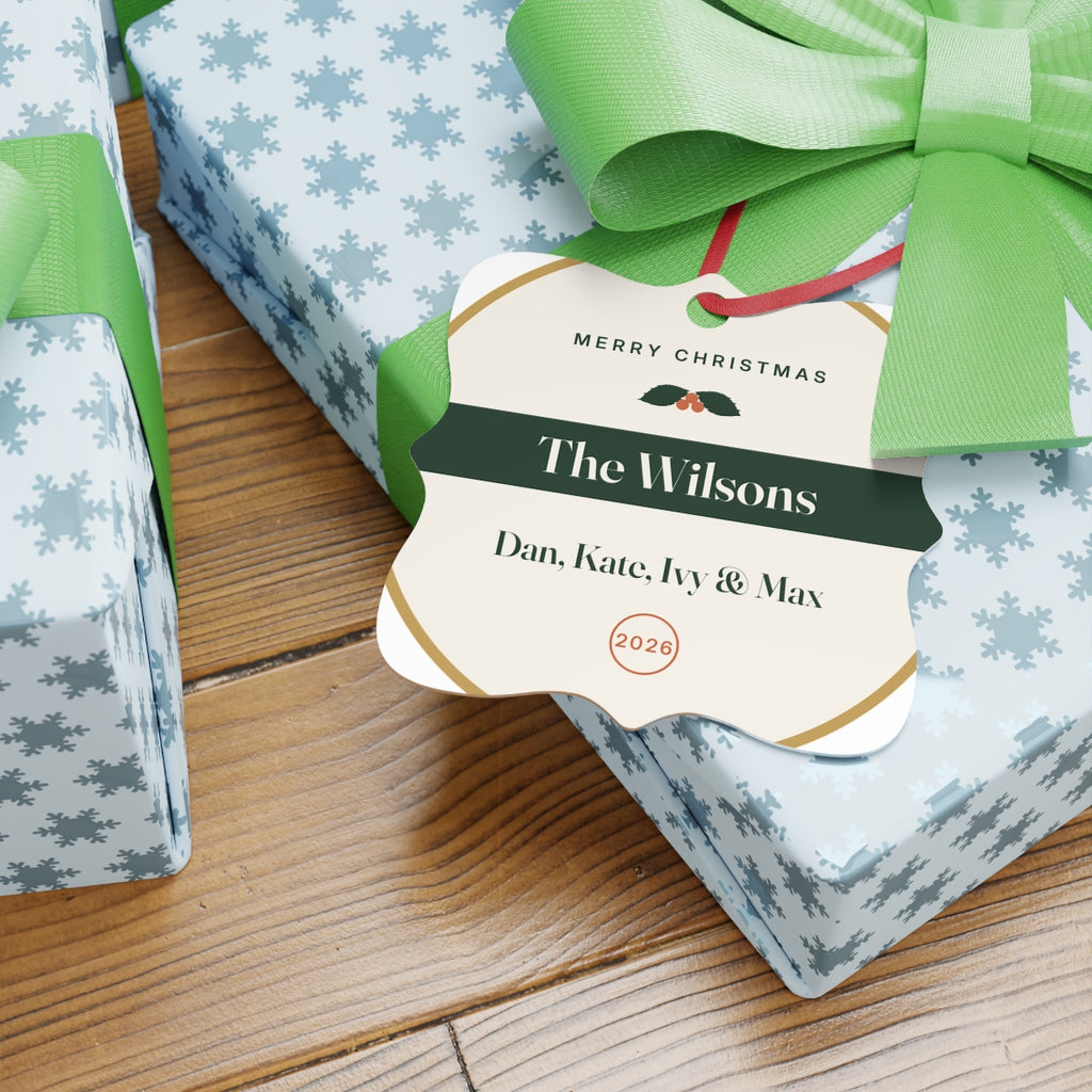 Family aluminium Christmas ornament mock-up on presents with green bows, 'The Wilsons' and 'Dan, Kate, Ivy & Max'