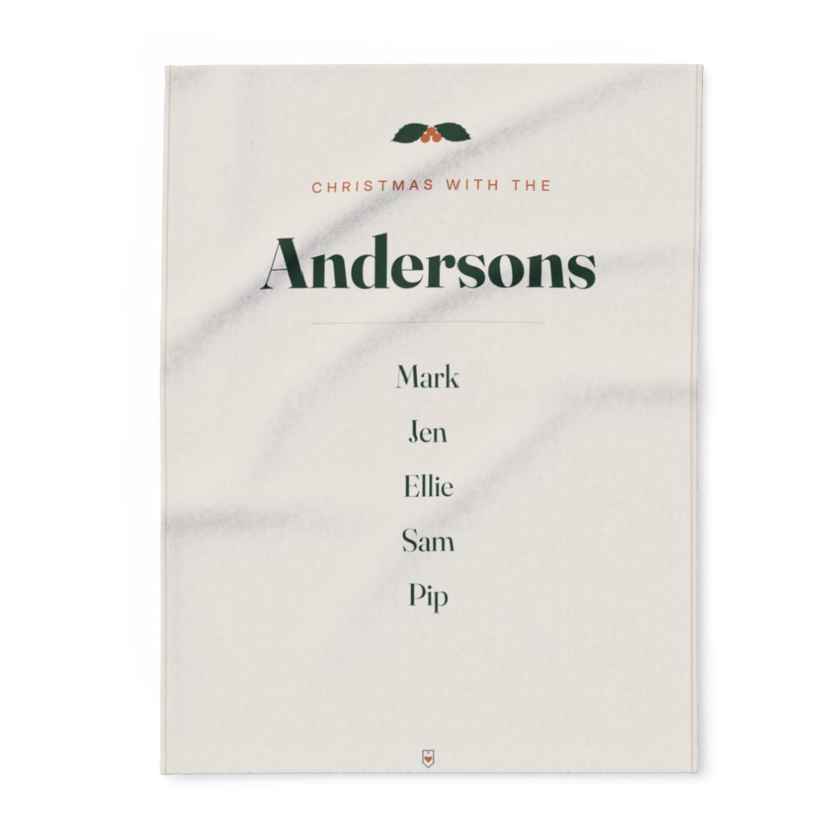 Family Christmas fleece blanket mock-up laid flat with holly, 'Christmas with the Andersons' and five sample names