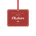 Family aluminium plaque ornament mock-up in red and gold with a ribbon, 'Merry Christmas from the Okafors' and '2026'