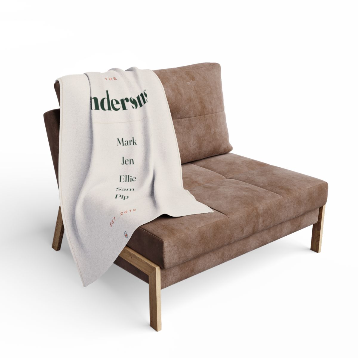 Personalised family name fleece blanket mock-up draped over a brown armchair, showing 'Andersons' and the five names