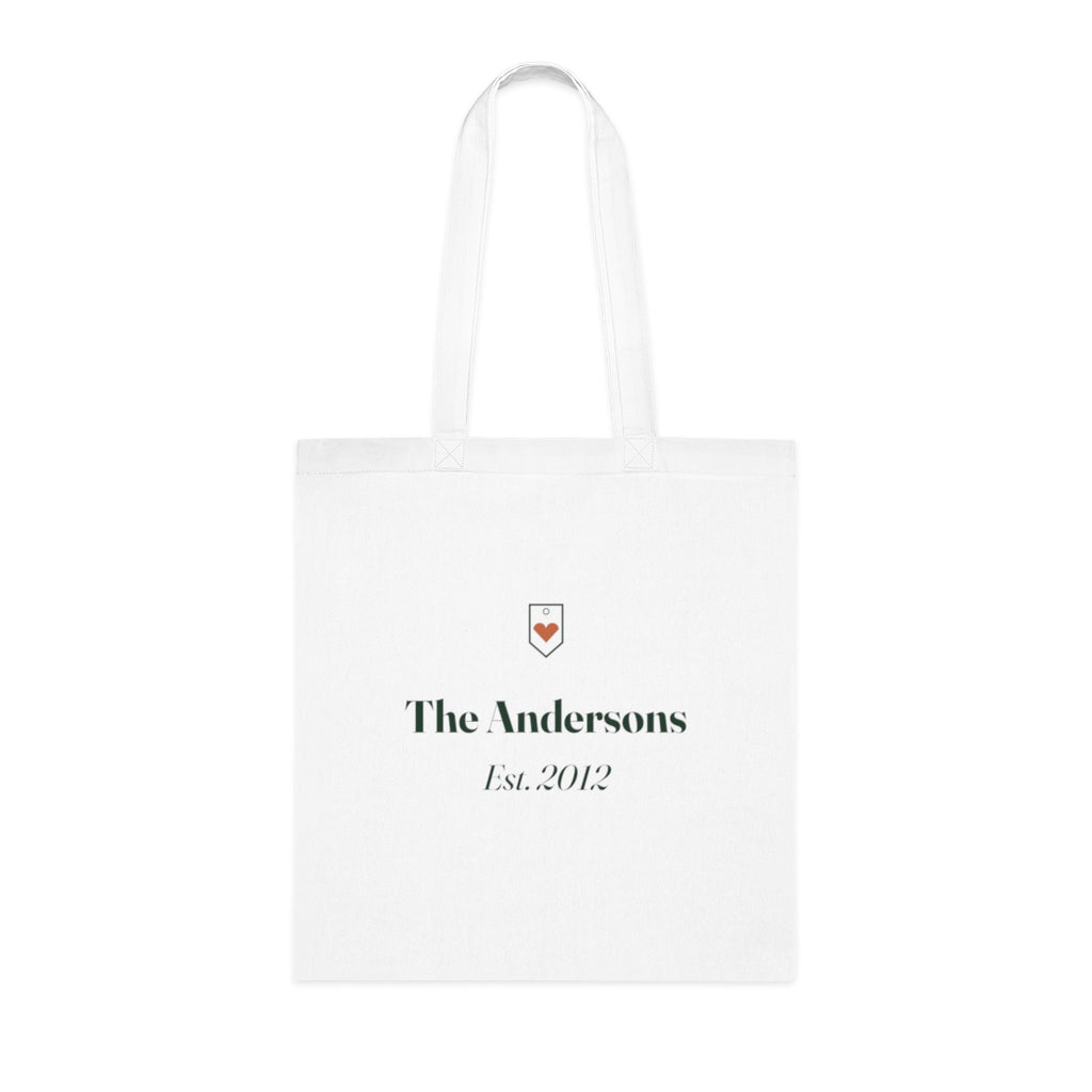 Personalised family name tote bag mock-up, white cotton with a small heart crest, 'The Andersons' and 'Est. 2012'