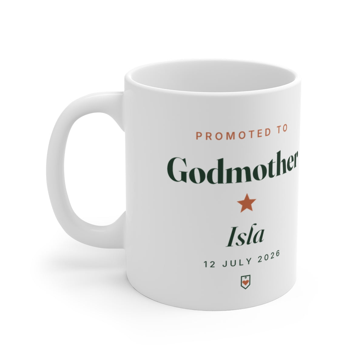 Personalised godmother mug mock-up, white mug with the handle on the left, printed 'Promoted to Godmother' and 'Isla'
