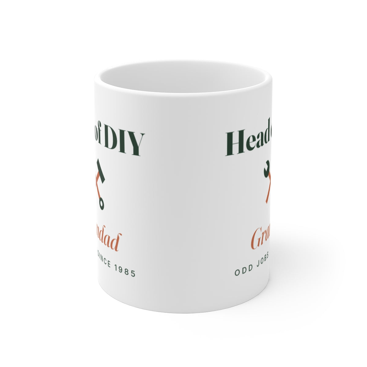 Head of DIY mug mock-up seen front-on with the handle hidden, showing the crossed tools design printed on both sides