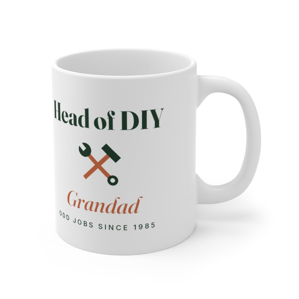 Head of DIY mug mock-up seen from the other side, handle on the right, crossed tools design with the sample name 'Grandad'