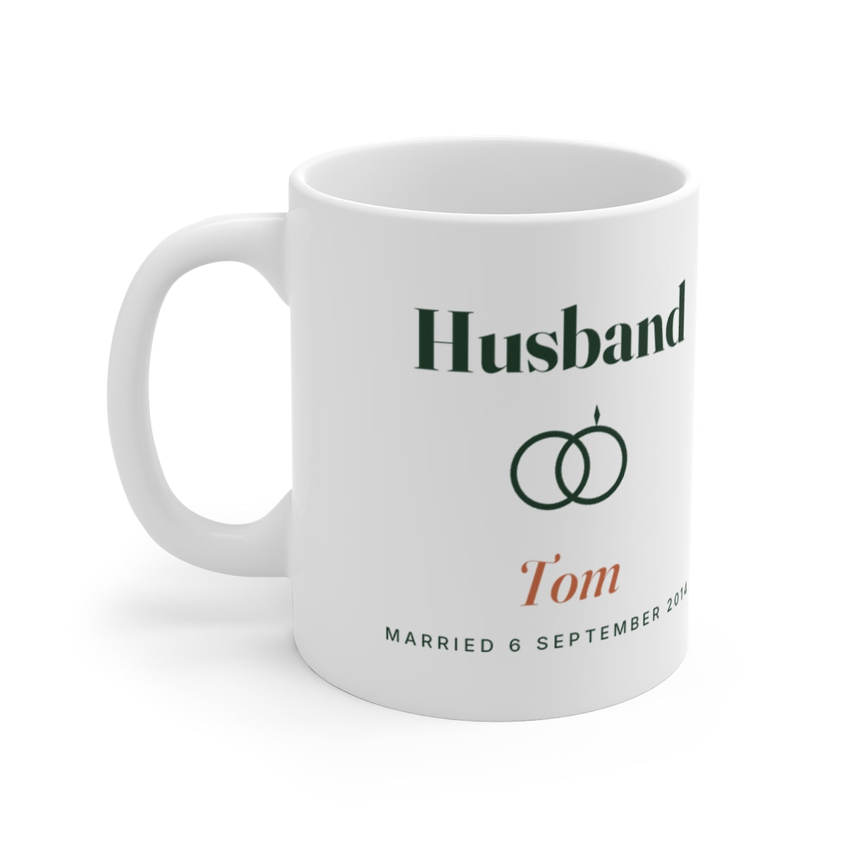 Personalised husband mug mock-up, handle left, printed 'Husband', two linked rings, 'Tom' and 'Married 6 September 2014'
