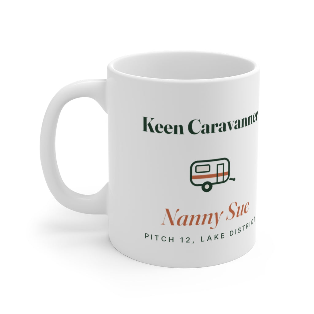 Personalised keen caravanner mug mock-up, handle on the left, with a small caravan, 'Nanny Sue' and 'Pitch 12, Lake District'