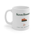 Personalised keen runner mug mock-up, handle on the left, with a terracotta running shoe, 'Jo' and 'First 10K, March 2026'
