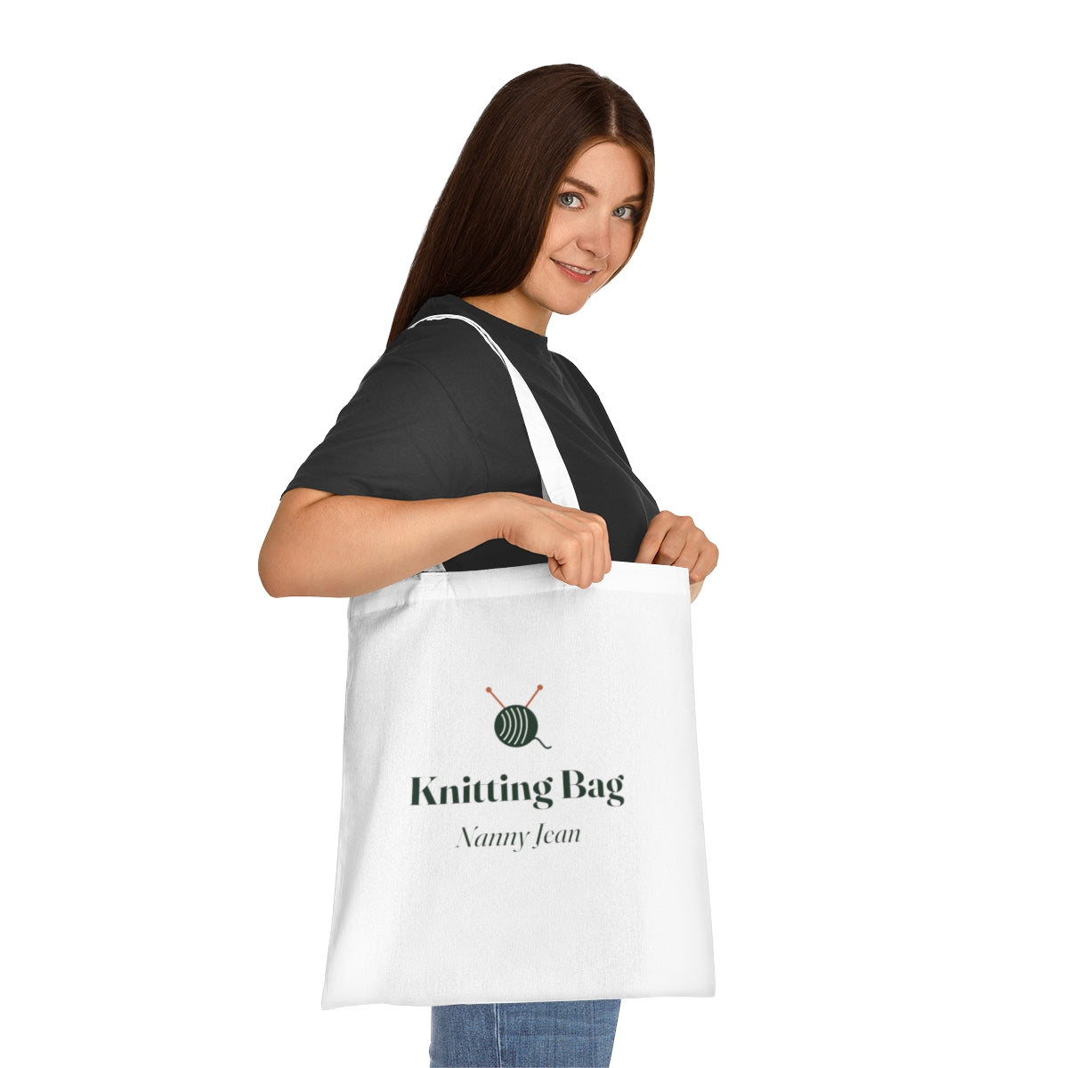 Personalised knitting tote bag mock-up carried on a woman's shoulder, showing the yarn motif and 'Nanny Jean'