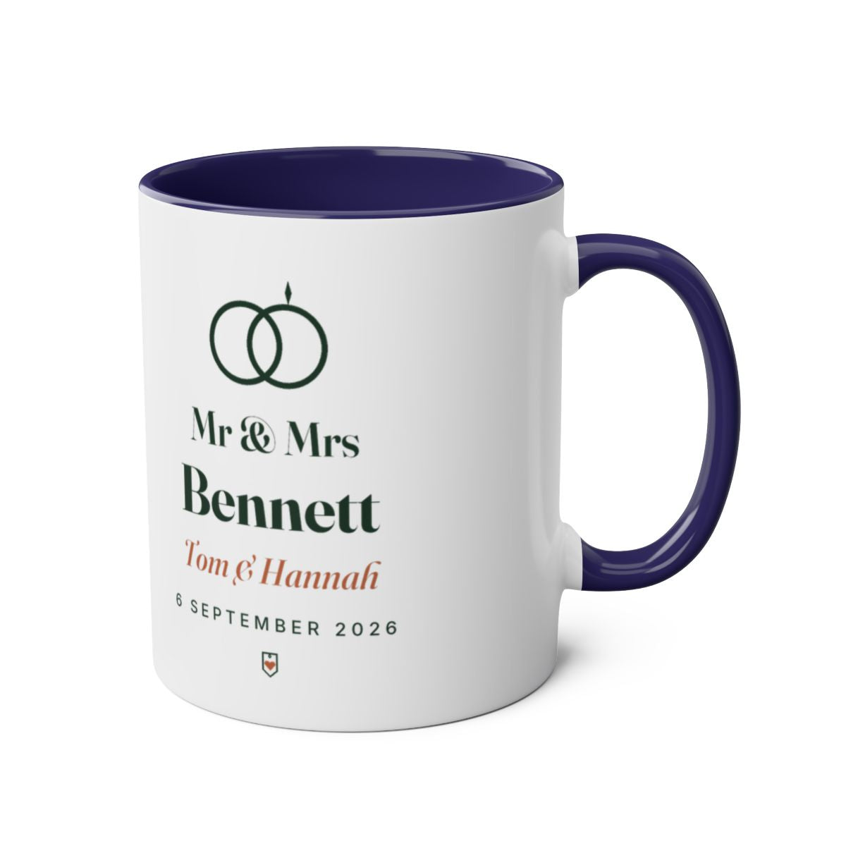 Personalised Mr & Mrs mug mock-up, dark blue two-tone, handle on the right, showing the rings motif and 'Mr & Mrs Bennett'