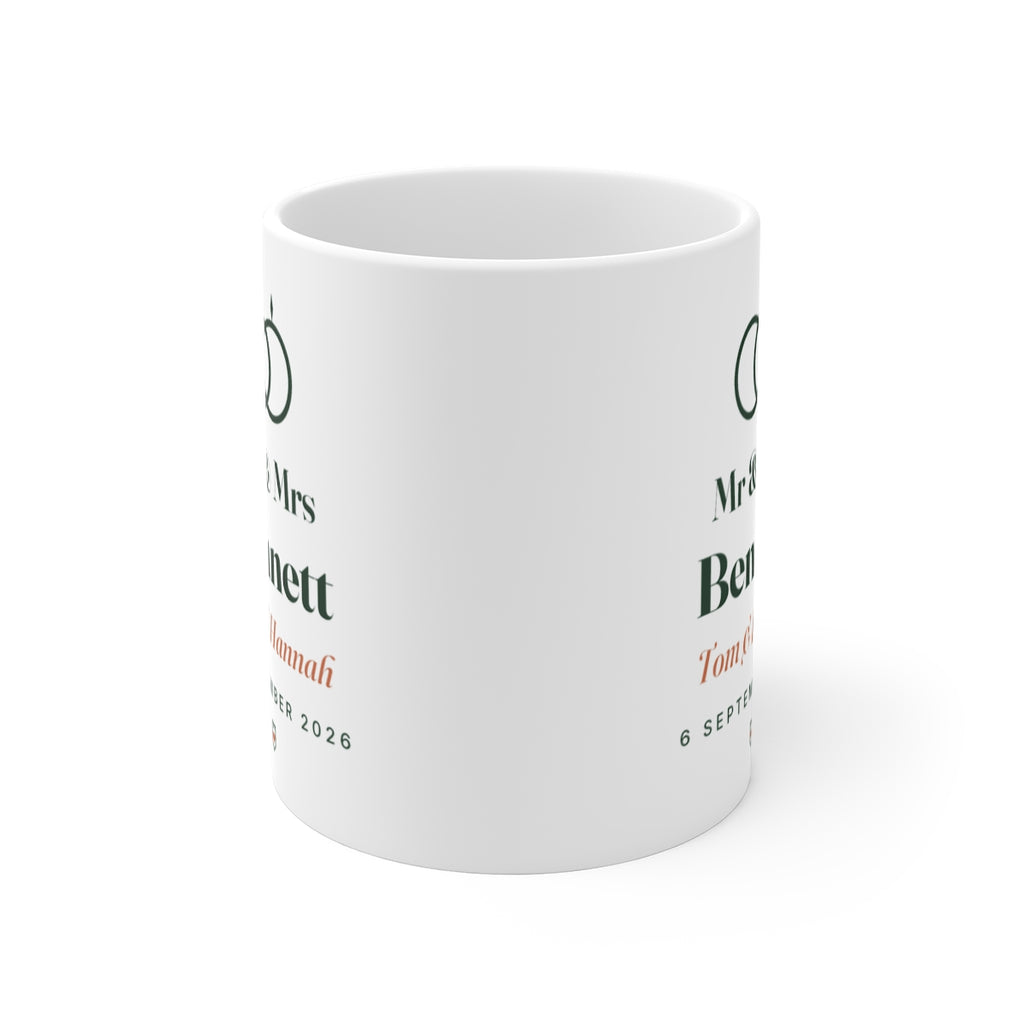Personalised Mr & Mrs mug mock-up seen from the front, showing the rings design printed on both sides of the white mug