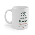 Personalised Mr & Mrs mug mock-up, handle left, printed with two rings, 'Bennett', 'Tom & Hannah' and '6 September 2026'