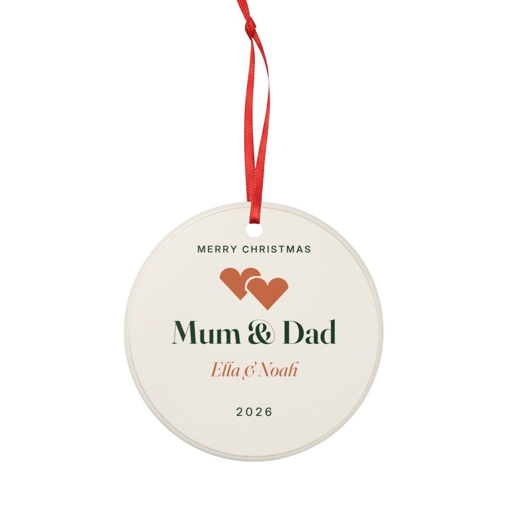 Personalised Mum and Dad Christmas ornament mock-up seen smaller with the red ribbon looped above, sample names 'Ella & Noah'