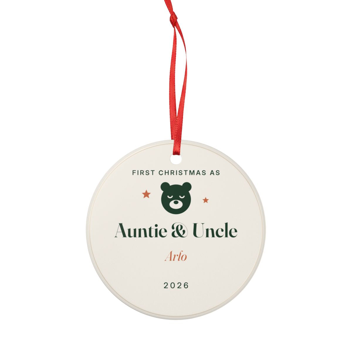 Personalised New Auntie and Uncle ornament mock-up seen smaller with the red ribbon looped above, bear face and 'Arlo'