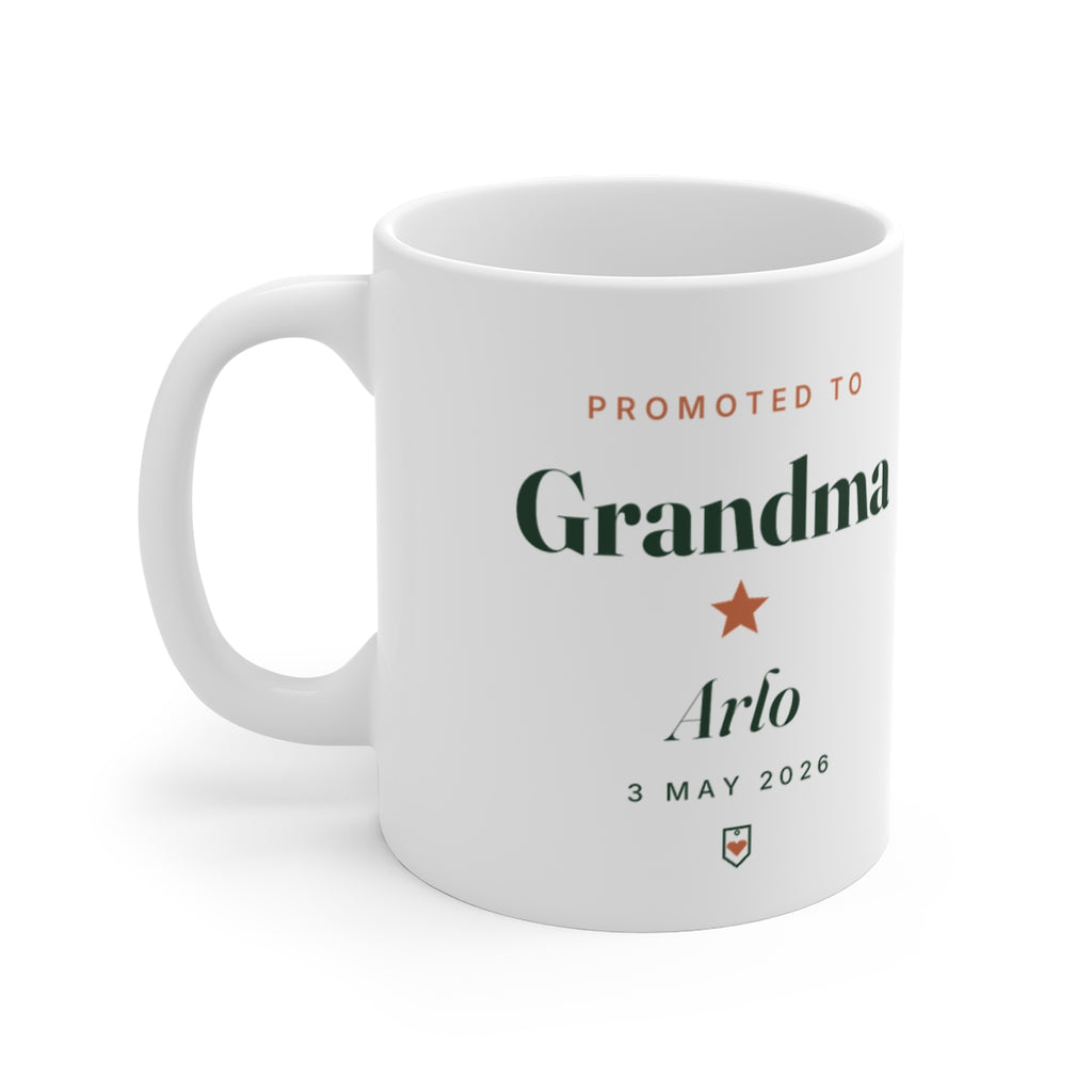 Personalised new Grandma mug mock-up, white mug printed 'Promoted to Grandma', a star, sample name 'Arlo' and '3 May 2026'