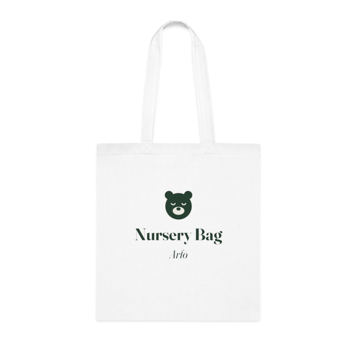 Personalised nursery bag tote mock-up, white cotton with a green bear, 'Nursery Bag' and the sample name 'Arlo', laid flat