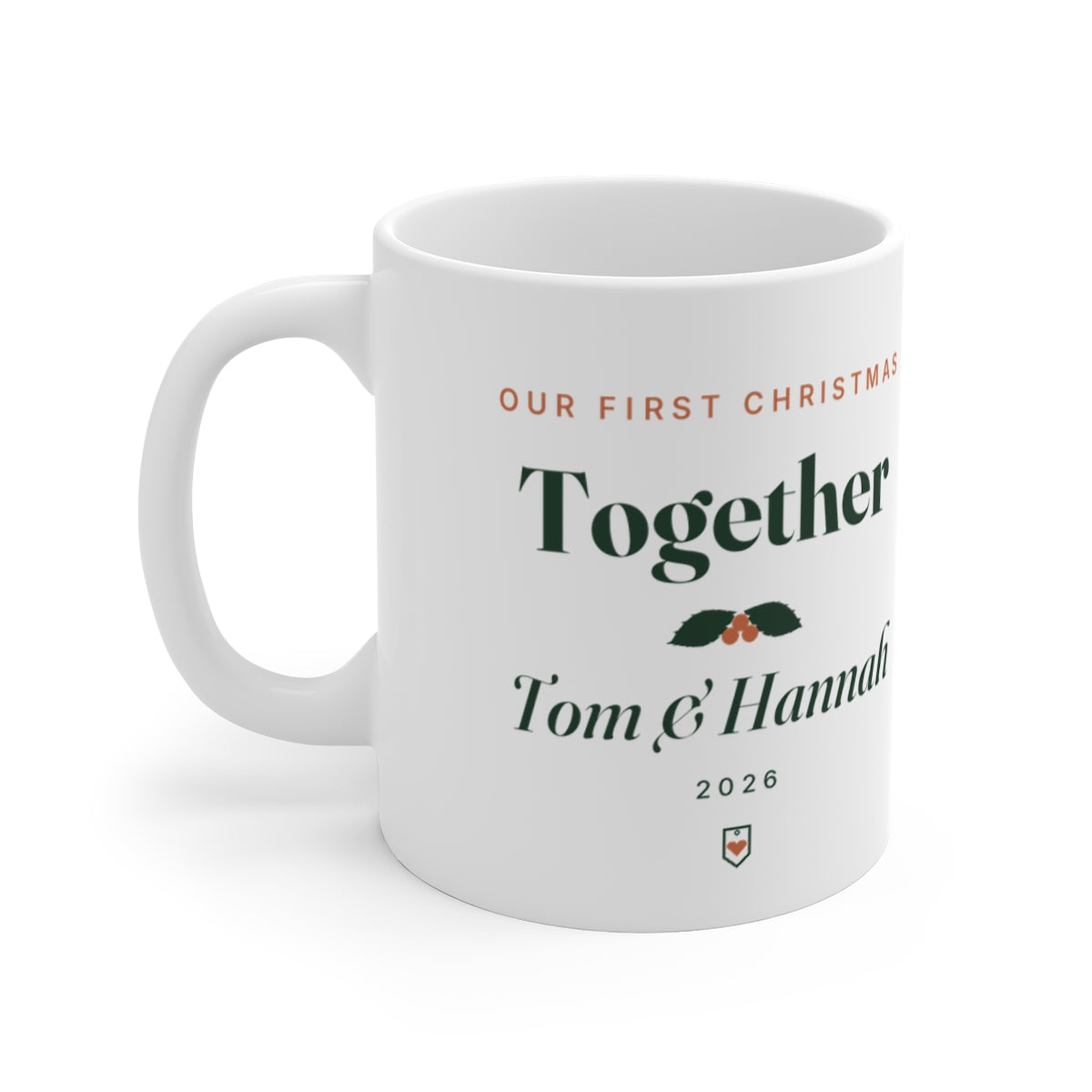 Personalised our first Christmas mug mock-up, white with 'Together', holly, 'Tom & Hannah' and '2026', handle on the left
