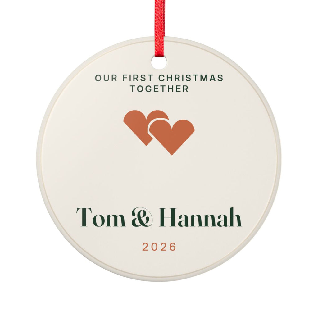 Personalised first Christmas together ornament mock-up, round cream ceramic with two hearts, 'Tom & Hannah' and '2026'
