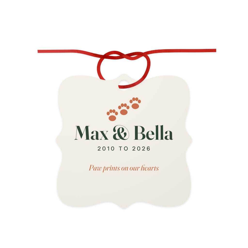Personalised pet memorial aluminium ornament mock-up, scalloped cream square with paw prints, 'Max & Bella', '2010 to 2026'