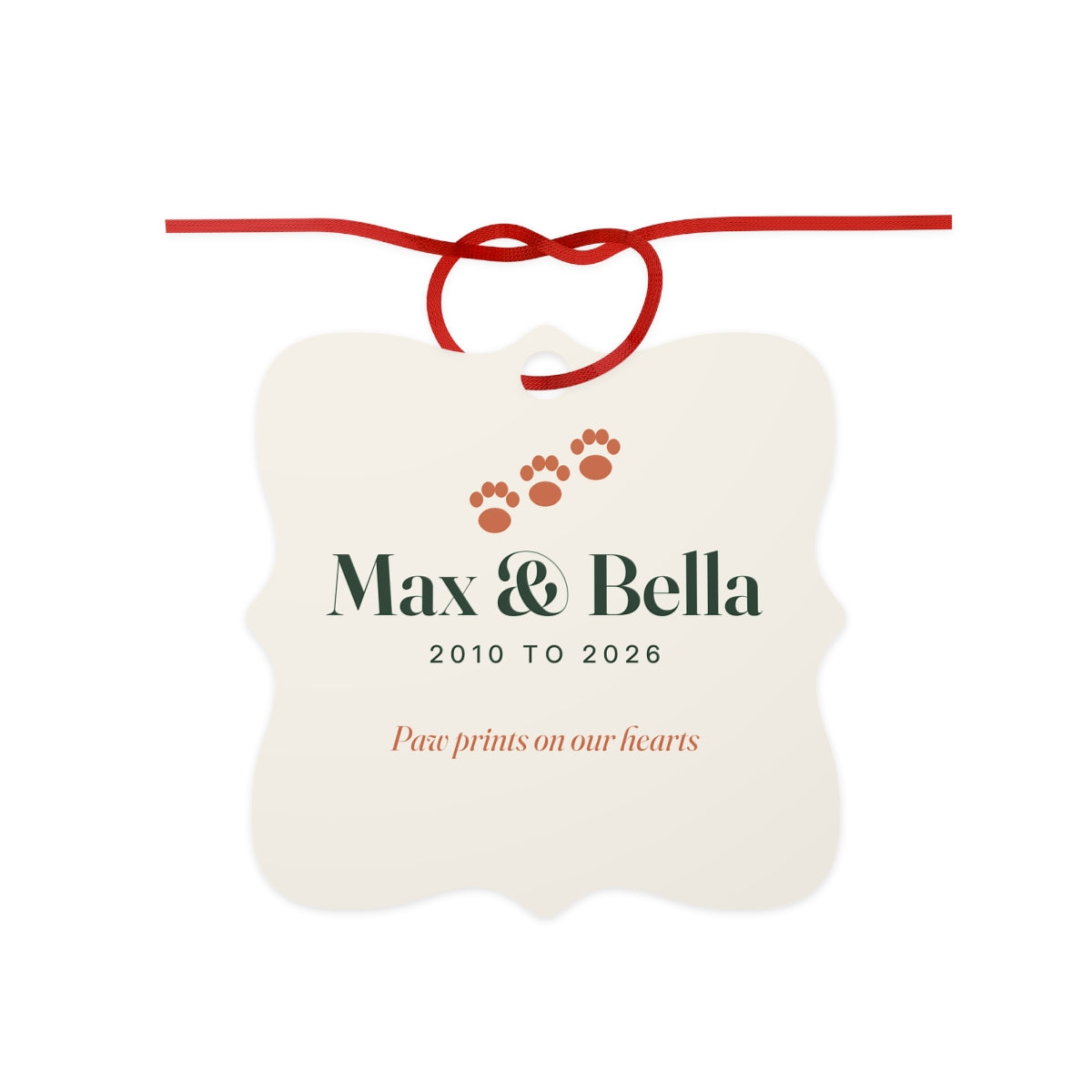 Personalised pet memorial aluminium ornament mock-up, scalloped cream square with paw prints, 'Max & Bella', '2010 to 2026'