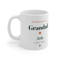 Personalised Promoted to Grandad mug mock-up with sample name 'Arlo' and '3 May 2026', handle on the left
