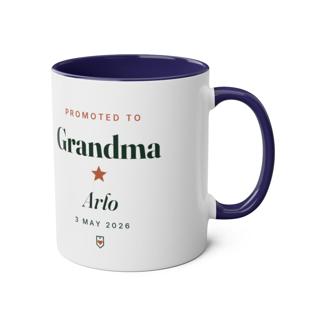 Promoted to Grandparent two-tone dark blue mug mock-up, handle on the right, printed 'Grandma', 'Arlo' and '3 May 2026'