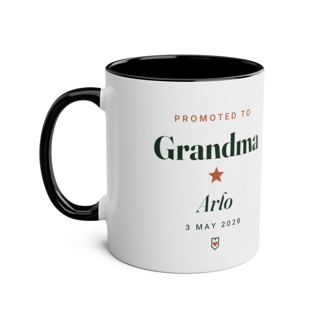 Promoted to Grandparent two-tone mug mock-up, black inside and handle on the left, sample text 'Grandma' and 'Arlo'