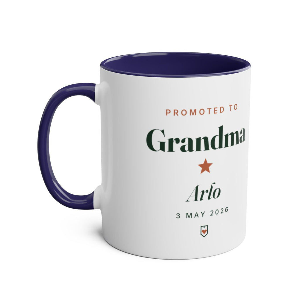 Promoted to Grandparent two-tone mug mock-up, dark blue inside and handle on the left, sample text 'Grandma' and 'Arlo'