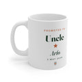 Personalised Promoted to Uncle mug mock-up with sample name 'Arlo' and '3 May 2026', handle on the left