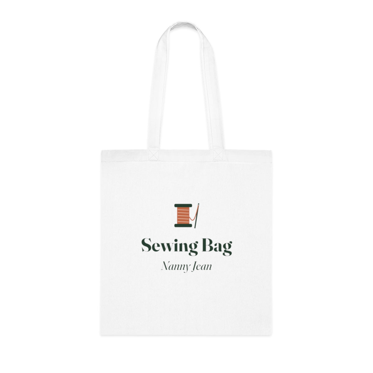 Personalised sewing bag tote mock-up, white cotton tote laid flat with a cotton reel, 'Sewing Bag' and 'Nanny Jean'
