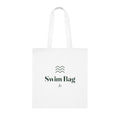 Personalised swim bag tote mock-up, white cotton tote laid flat with three wave lines, 'Swim Bag' and 'Jo'