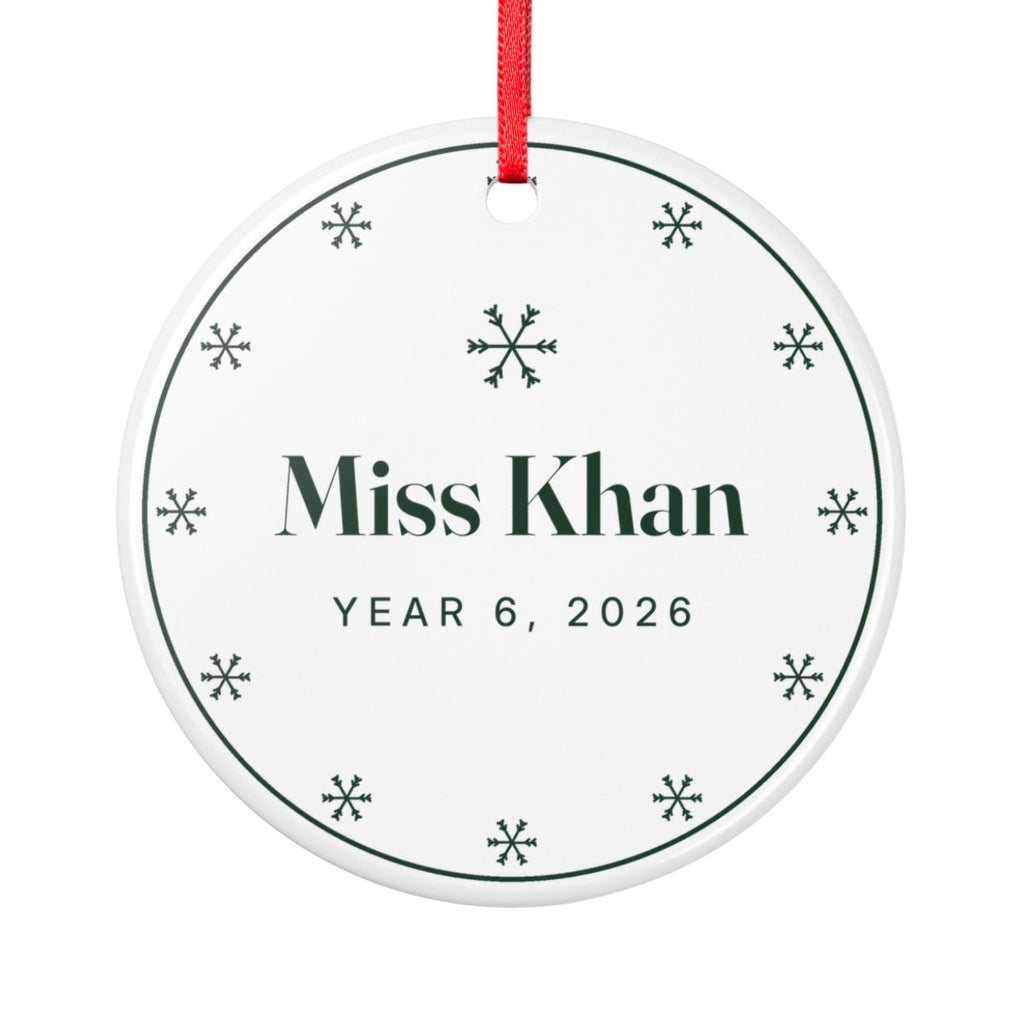 Teacher ceramic Christmas ornament mock-up, round with a red ribbon, green snowflakes, 'Miss Khan' and 'Year 6, 2026'