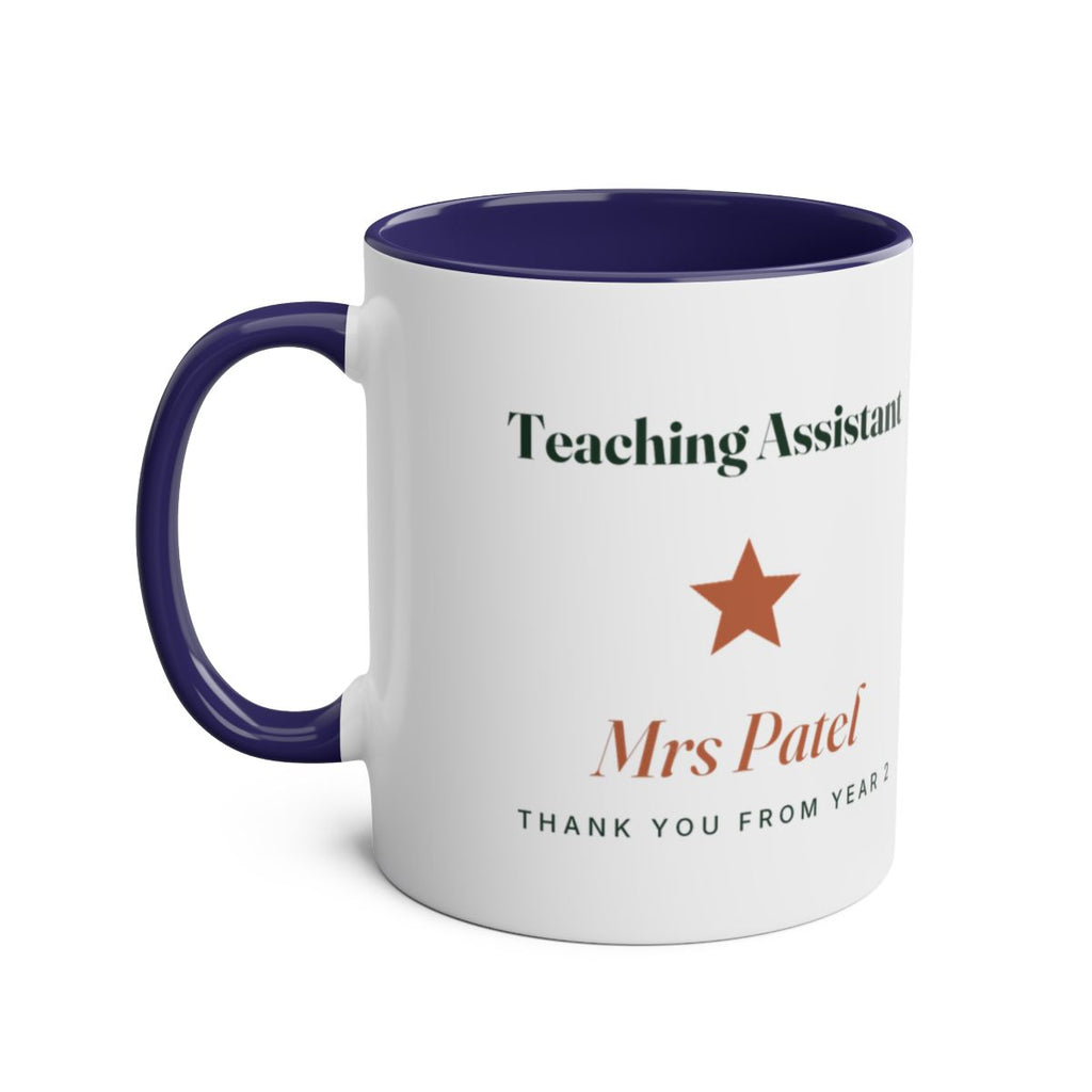 Teaching Assistant two-tone mug mock-up in dark blue, handle on the left, with the star and sample name 'Mrs Patel'