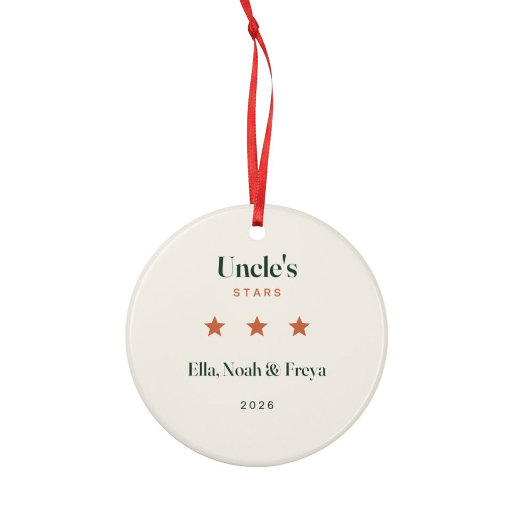 Personalised Uncle's Stars ceramic ornament mock-up shown smaller with its full red hanging ribbon tied in a loop above