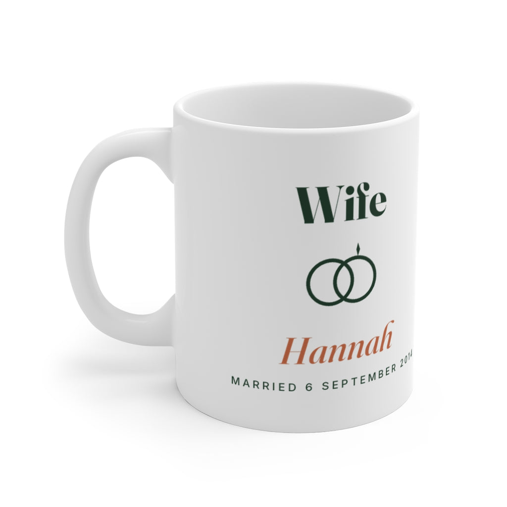 Personalised Wife mug mock-up with linked rings, sample name 'Hannah' and 'Married 6 September 2014', handle on the left