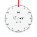 Snowflake ceramic Christmas ornament mock-up, round with a red ribbon, a ring of green snowflakes, 'Oliver' and '2026'